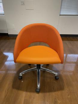 Global Orange chair on casters chrome base